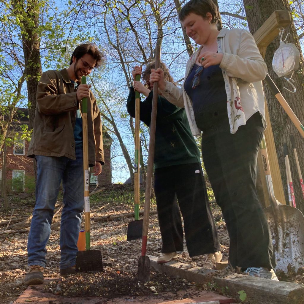 Students composting in the Grove