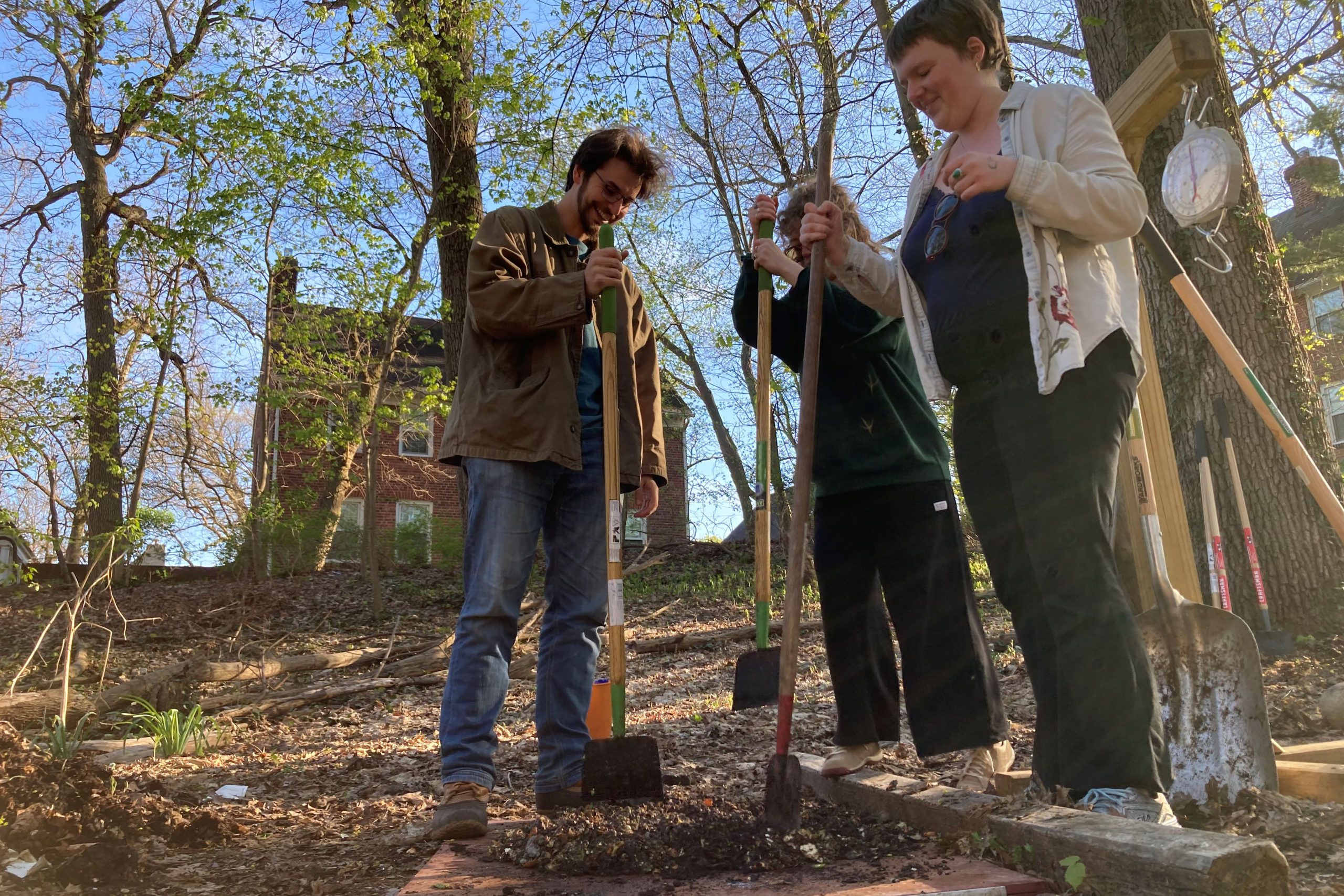 Students composting in the Grove