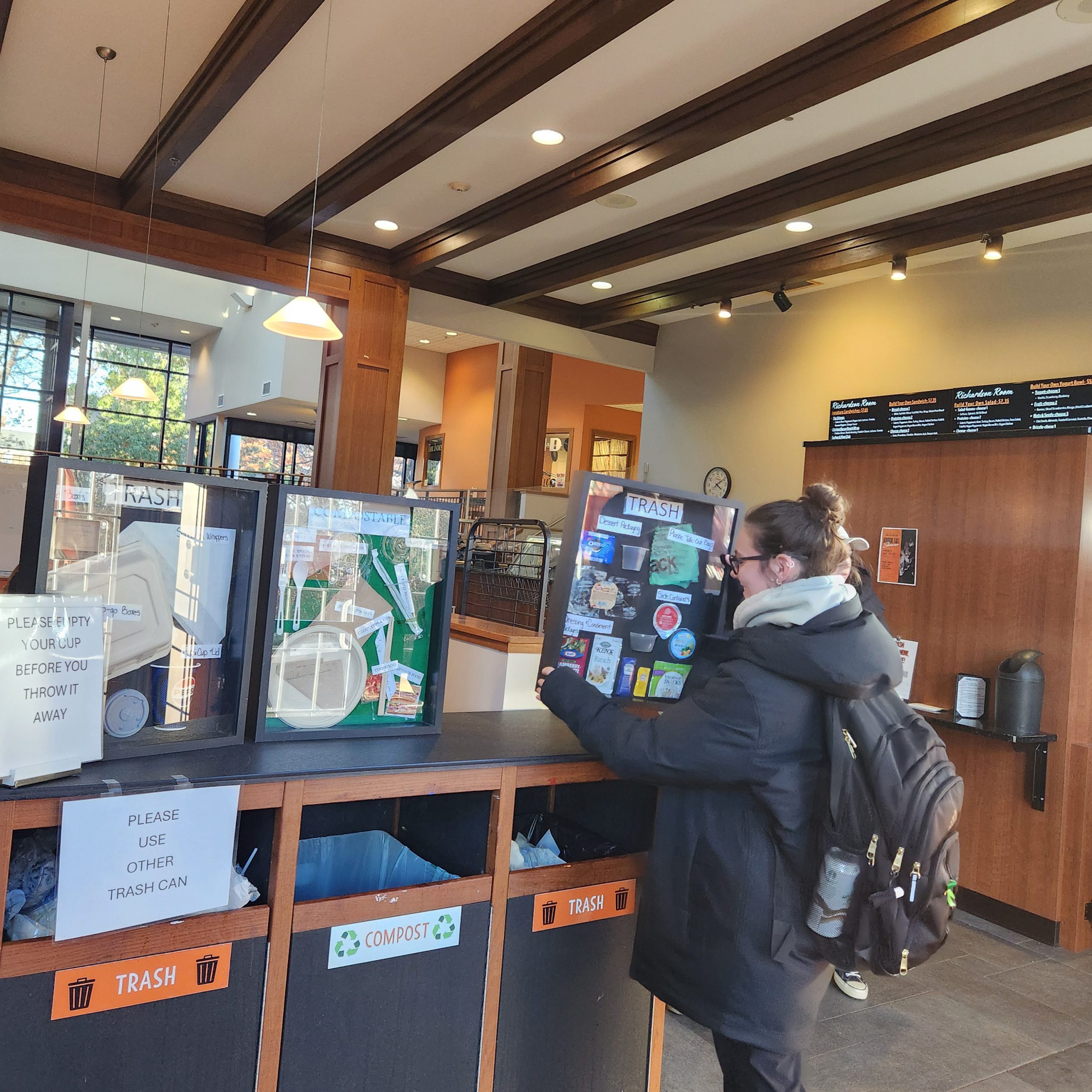 Madi Magda placing waste management shadowboxes