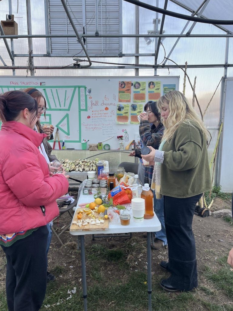People mingling at Hoop House fire cider event